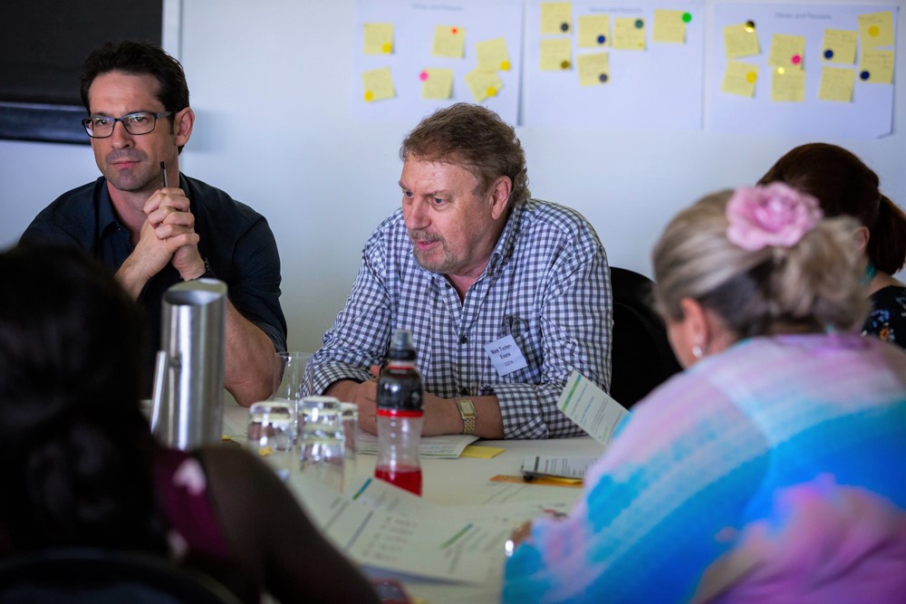 COTA Queensland CEO Mark Tucker-Evans (centre), engrossed in a 2018 policy and planning session to improve the coordination of Brisbane North aged care services. 